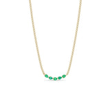 Zoe Chicco 14k gold chain necklace with five pear-shaped green emeralds connected in the center on a white background