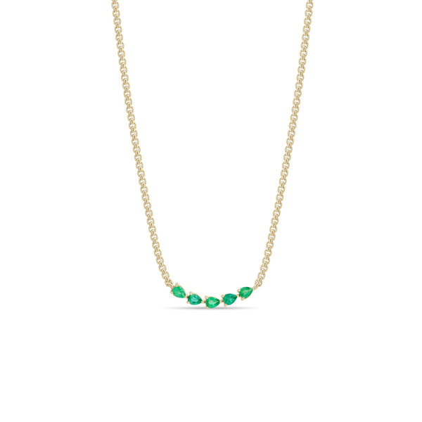 Zoe Chicco 14k gold chain necklace with five pear-shaped green emeralds connected in the center on a white background
