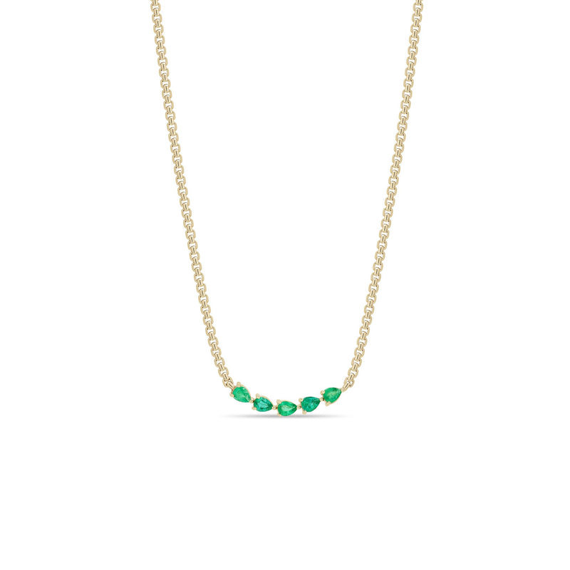 Zoe Chicco 14k gold chain necklace with five pear-shaped green emeralds connected in the center on a white background