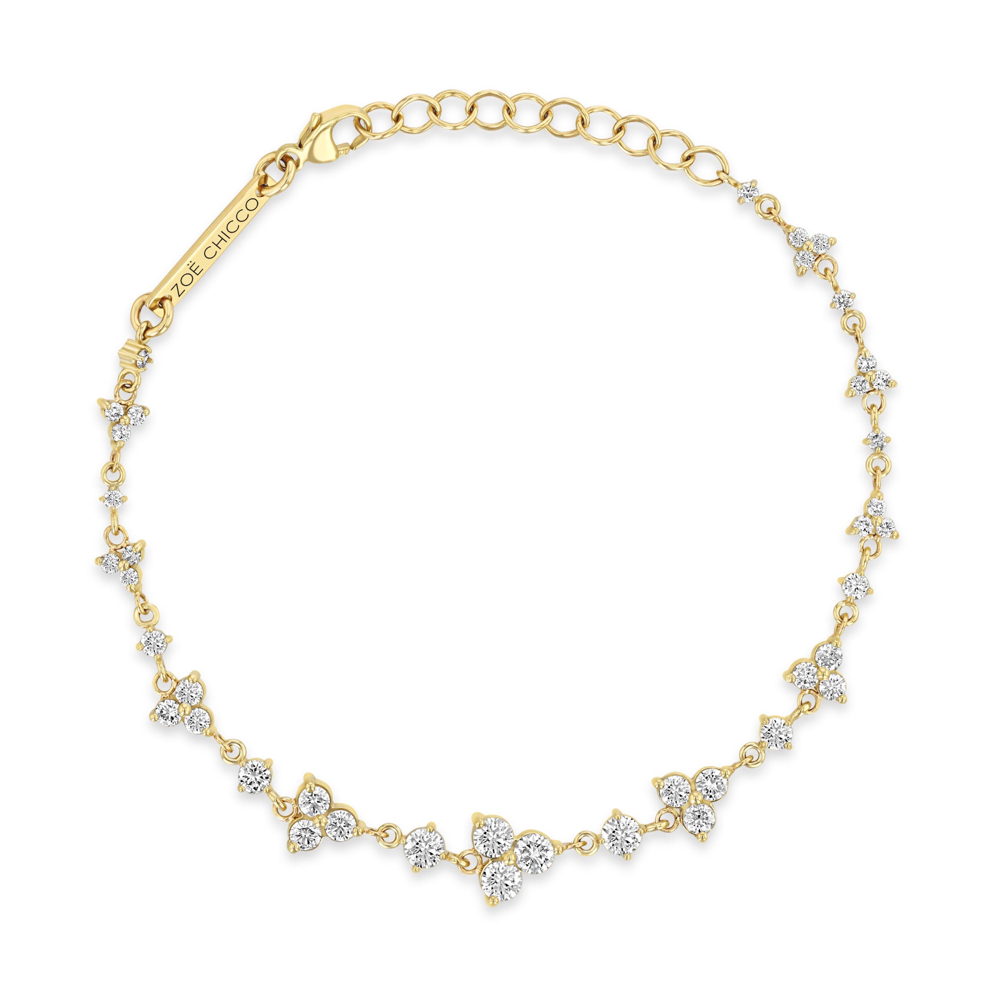 top down view of a Zoë Chicco 14k Gold Alternating Graduated Prong Diamond & Diamond Trio Bracelet