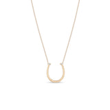 Zoe Chicco 14k rose gold chain necklace with horseshoe pendant and two small baguette diamonds on a white background 
