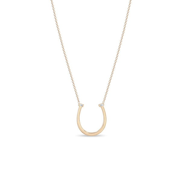 Zoe Chicco 14k rose gold chain necklace with horseshoe pendant and two small baguette diamonds on a white background 