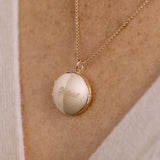 close up of a Zoë Chicco 14k Gold Grateful Round Locket Box Chain Necklace being worn on model