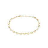 Zoe Chicco 14k gold heart shaped link chain bracelet on a white background