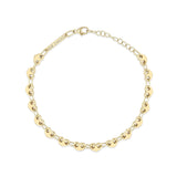 Zoe Chicco 14k gold heart shaped link chain bracelet on a white background