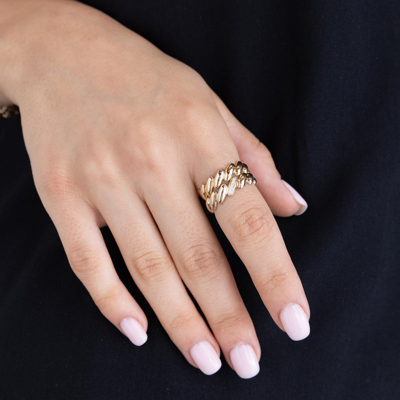 a woman's hand wearing a Zoë Chicco 14k Gold Pavé Diamond Line San Marco Band Ring stacked with a 14k Gold San Marco Band Ring on her index finger