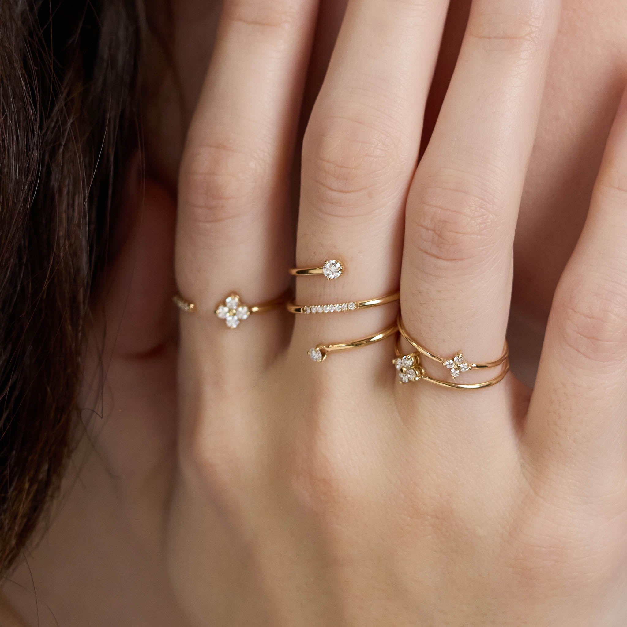 Zoe Chicco 14K gold rings with diamonds on a hand