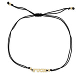 black cord bracelet with 14k gold in the center