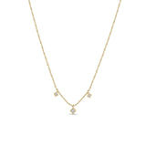 Zoe Chicco 14k gold bead chain necklace with three square diamond pendants handing towards the center on a white background