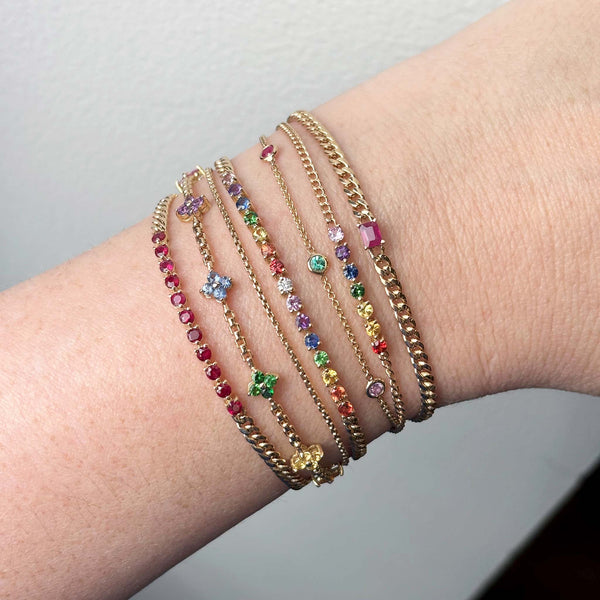 Zoe Chicco bracelet stack of rainbow gemstones and rubies.