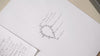 Video of jewelry sketches and Zoe Chicco 14k gold earrings, jewels, and chains being designed
