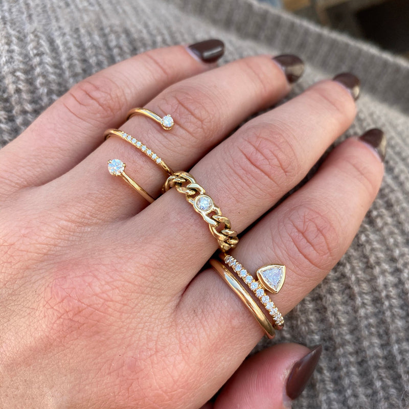 woman's hand wearing a Zoë Chicco 14k Gold Classic 2mm Rounded Band Ring on her index finger