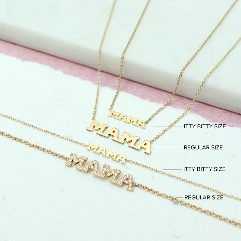 flat lay with Zoë Chicco 14kt Gold Itty Bitty MAMA Necklace