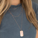 woman in grey t-shirt wearing a Zoë Chicco 14kt Rose Gold 11 Dangling Diamonds Bead Chain Necklace