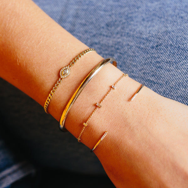 woman's wrist wearing Zoë Chicco 14kt Gold Half Round Cuff Bracelet