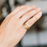 close up of woman's hand wearingZoe Chicco 14k Gold Small Bezel Marquise Diamond Ring on her pinky