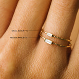 comparison image of two Zoë Chicco 14k Gold Horizontal Baguette Diamond Rings in different sizes on a finger