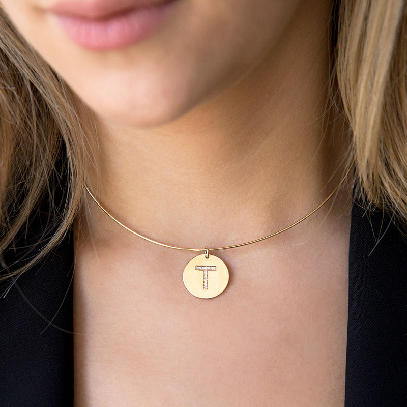 woman wearing Zoë Chicco 14kt Gold Pave Letter Round Initial Disc Charm Pendant on a Gold Wire Collar Necklace