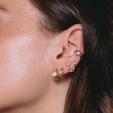close up of woman's ear wearing Zoë Chicco 14k Gold 3 Pavé Diamond Row Door Knocker Huggie Hoop Earring