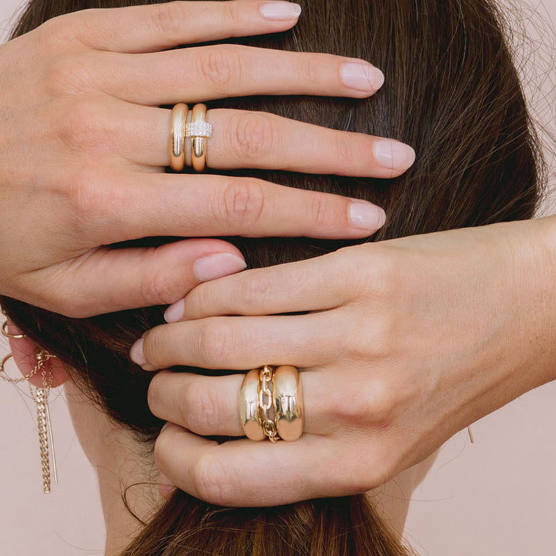back of woman's head with hands placed on the back of her head wearing Zoë Chicco 14k Yellow Gold Small Aura Ring