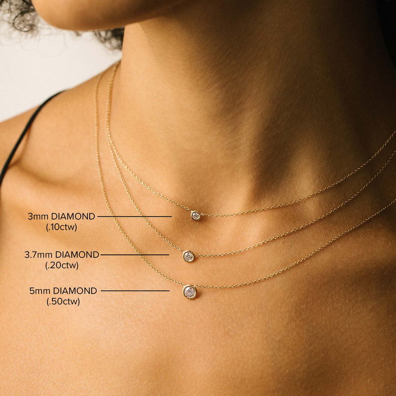 comparison image of three different sizes of Zoë Chicco 14k Gold Classic Floating Diamond Solitaire Necklaces layered together