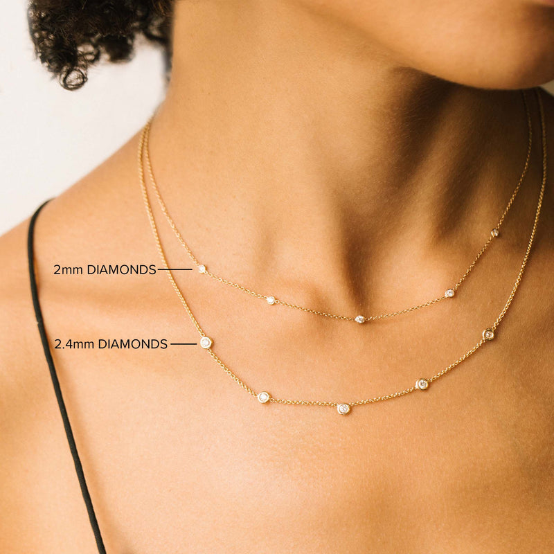 comparison image of two Zoë Chicco 14k Gold 5 Floating Diamond Station Necklaces layered together with different diamond sizes