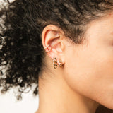 woman wearing a Zoë Chicco 14k Gold Medium Curb Chain Huggie Hoop with a Large Curb Chain Drop Earring and a Mixed Wire Pave Diamond Double Ear Cuff
