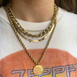woman in Zeppelin shirt wearing Zoë Chicco 14kt Gold Extra Large Open Link Curb Chain Necklace with a Herringbone Chain and a Large Rope chain necklace