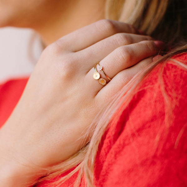 woman wearing a Zoë Chicco 14k Gold Pavé Diamond Medium Disc Ring on her ring finger