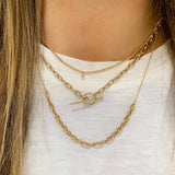 woman in white tshirt wearing a Zoë Chicco 14k Gold Prong Diamond Extra Small Curb Chain Necklace