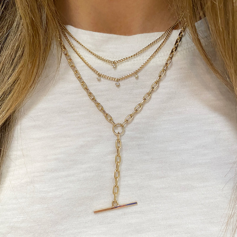 woman in white t-shirt wearing a Zoë Chicco 14k Gold  3 Dangling Prong Diamond Extra Small Curb Chain Necklace