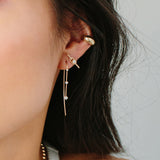 close up of woman's ear wearing Zoë Chicco 14kt Gold Graduating 3 Prong Diamond Wire Hook Earrings