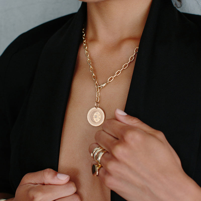 woman wearing Zoë Chicco 14kt Gold Diamond Celestial Protection Medallion Necklace with Adjustable Fob Closure