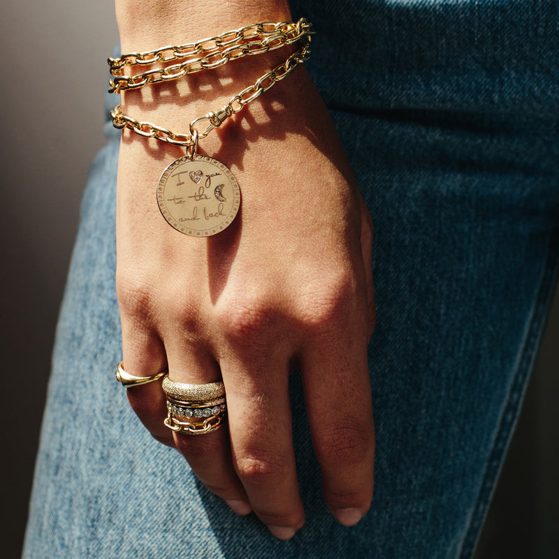 Zoe Chicco 14kt Gold Large "I <3 You To The Moon & Back" Mantra Necklace wrapped around a wrist and worn like a bracelet