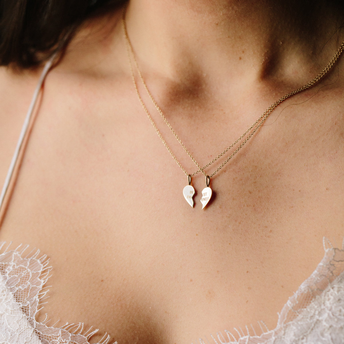 woman in white lace top wearing Zoë Chicco 14k Gold Midi Bitty "Best Friends" BFF Necklace Set