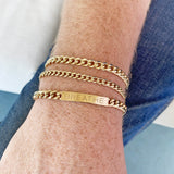 Zoe Chicco men's bracelet stack with large curb chain bracelet, medium curb chain bracelet, and a large curb chain ID bracelet