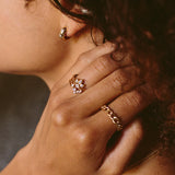 woman's hand resting on her neck wearingZoë Chicco 14k Gold Prong & Princess Diamond Open Ring on her ring finger