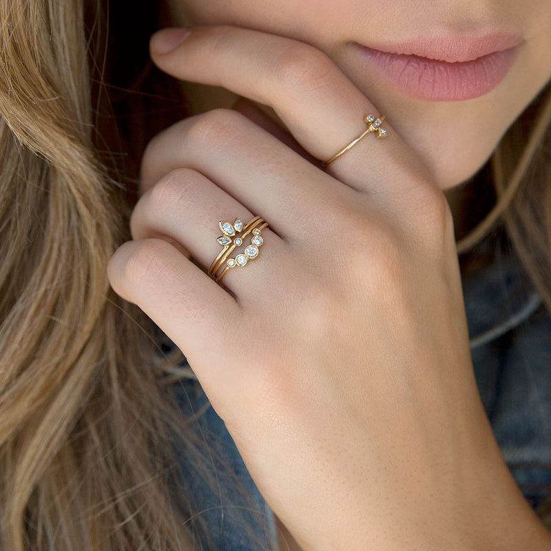 woman's hand resting on chin wearing Zoë Chicco 14kt Gold Stacked Mixed Cut Diamond Ring on her index finger