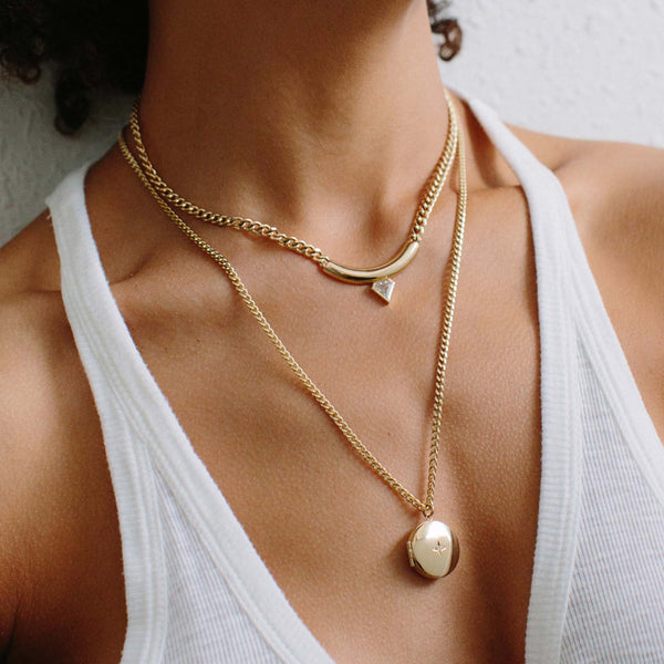 woman in white tank top wearing a One of a Kind Zoë Chicco 14k Gold Chubby Shield Diamond Bar Large Curb Chain Necklace