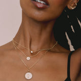 woman in black camisole top wearing a Zoë Chicco One of a Kind 14k Gold Hexagon Cut Diamond Bezel Necklace