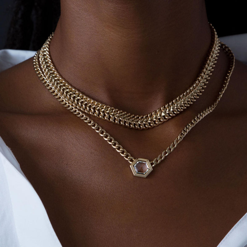 close up of woman's neck wearing a Zoë Chicco One of a Kind 14k Gold Hexagon Rose Cut Diamond on Medium Curb Chain Necklace layered with a Double Wide Curb Chain Necklace