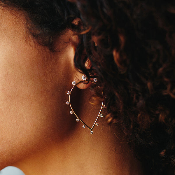 woman's side profile wearing Zoe Chicco 14kt Gold Medium Teardrop Earrings with Diamonds