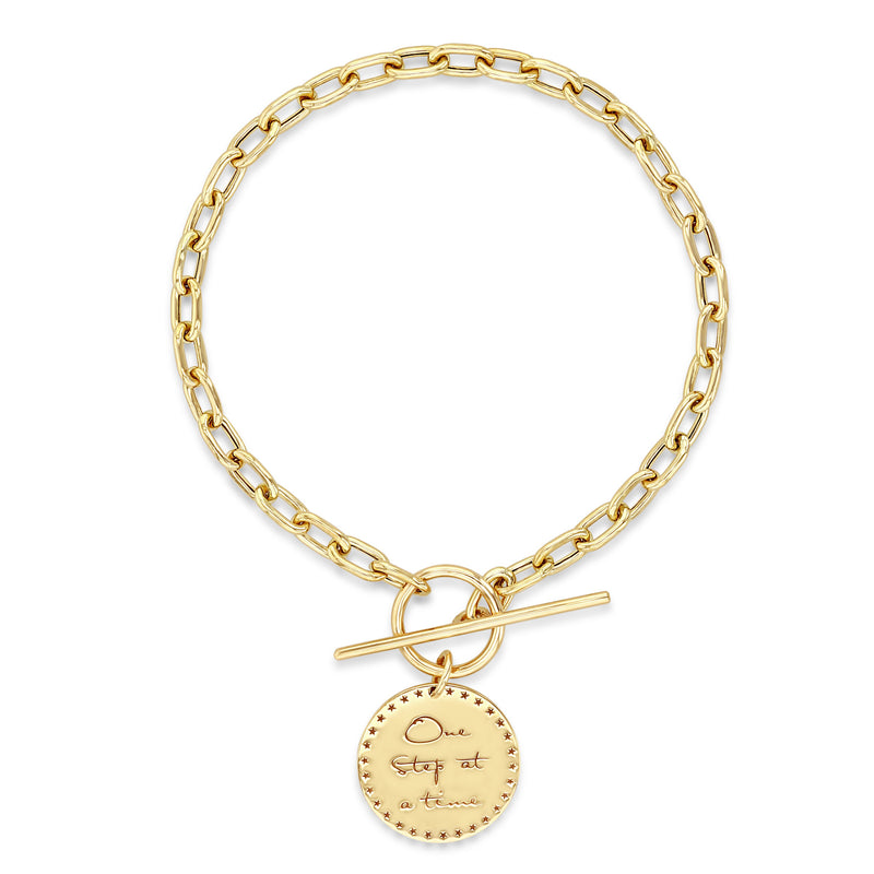 aerial view of Zoë Chicco 14k Gold Small Mantra Charm Square Oval Chain Toggle Bracelet laid out flat