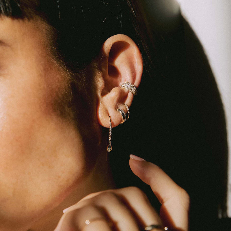 woman's ear wearing Zoë Chicco 14k Gold Diamond Snake Head Pavé Diamond Wire Threader Earrings