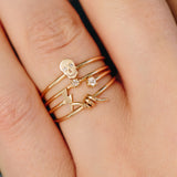 Close up of a woman's finger wearing a Zoë Chicco 14k Gold Prong Diamond Solitaire Ring