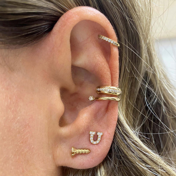 woman's ear wearing Zoë Chicco 14k Gold Tiny Screw Stud Earring