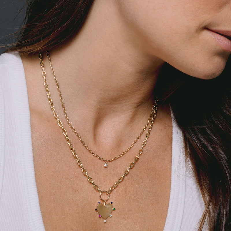 woman wearing a Zoë Chicco 14k Gold 7 Rainbow Gemstones Heart Pendant on Medium Square Oval Chain Necklace