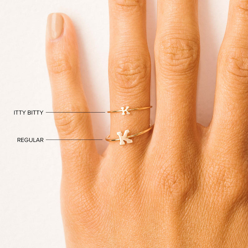 woman's hand with Zoë Chicco 14kt Gold Initial Letter RingS