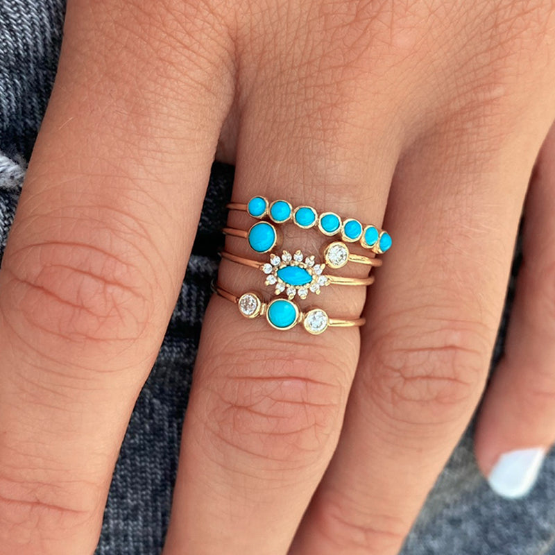 woman's hand wearing a Zoë Chicco 14k Gold Turquoise & Diamond Bezel Open Ring on her middle finger