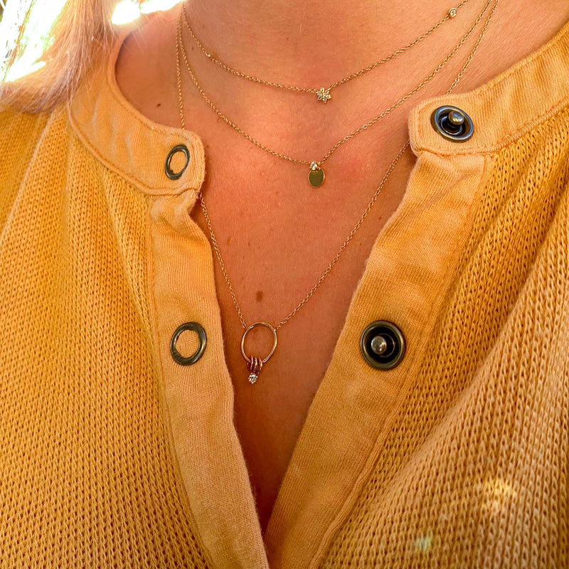 woman wearing Zoë Chicco 14kt Gold Prong Diamond Disc Necklace layered with two other necklaces